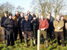 Ian Butterfield is shown in the red shirt at a tree planting we did in December 2014